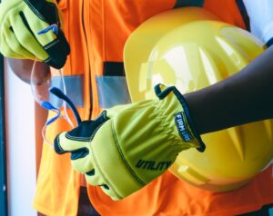 Close-up of personal protective equipment including gloves and helmet, essential for safety.